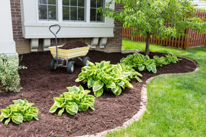 spring home maintenance | front of house with mulch