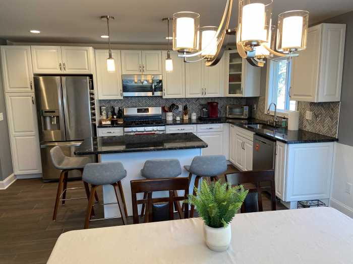 newly renovated kitchen with white cabinets